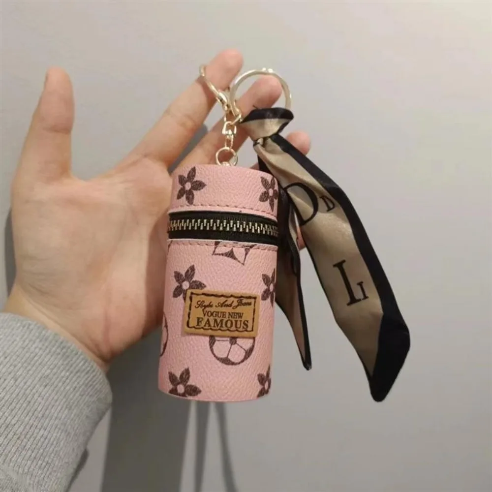 Monogram Keychain Leather - Bolsa Cilíndrica Mini para Batom com